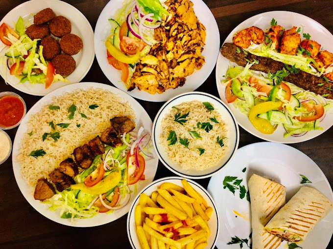 A spread of kebabs, shawarma, falafel, rice and wraps